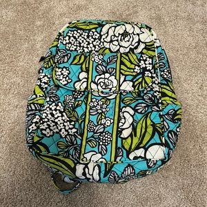 Vera Bradley mini backpack adjustable straps, two zippers, and one magnet clip.